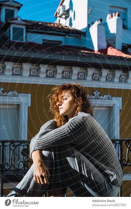 Young woman posing on balcony Woman Home pretty Balcony Relaxation Sit eyes closed Youth (Young adults) Posture Portrait photograph Beautiful Lifestyle