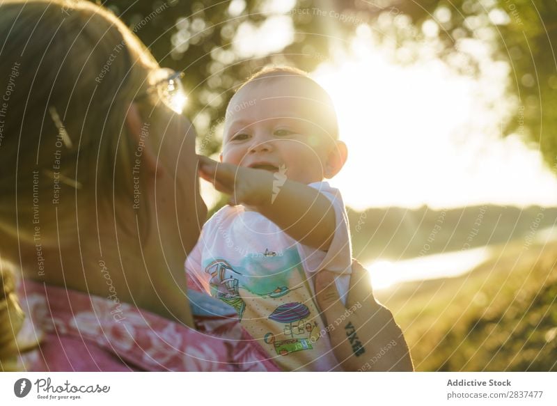 Mother with child in park Child Park Lawn Green Sunbeam Family & Relations Happy Human being Woman Happiness Summer Lifestyle Love Parents Nature