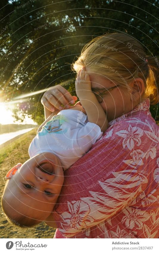 Mother playing with child in park Child Park Playing Sunbeam Family & Relations Happy Human being Woman Happiness Summer Lifestyle Love Parents Nature