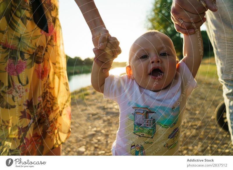 Lesbian couple and child walking in park Mother Child Park Legs Walking Green Sunbeam Family & Relations Happy Human being Happiness Summer Lifestyle Love