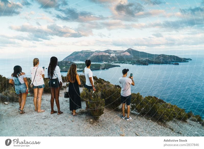 Group of people standing on cliff Human being Tourism Landscape Freedom Action Ocean Adventure Summer Exterior shot Vacation & Travel Tourist multiethnic Black