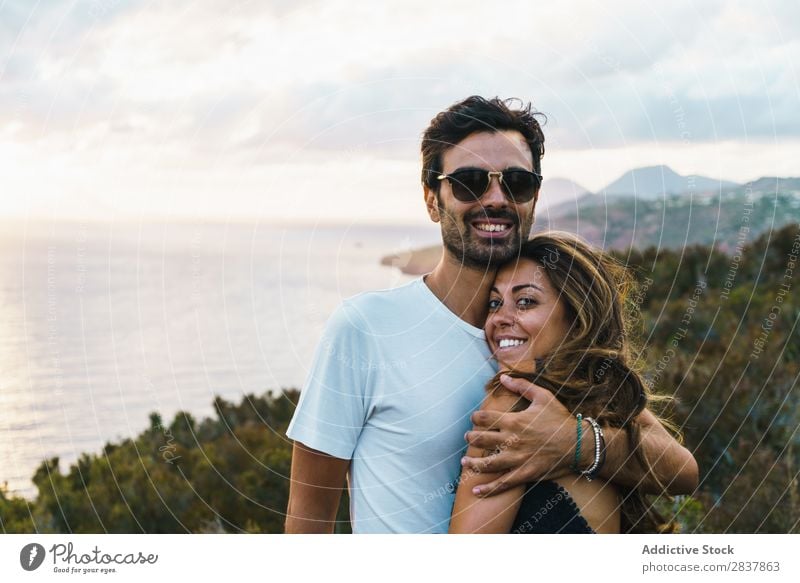 Cheerful couple posing on nature Couple Landscape Posture Ocean embracing Tourist Adventure Nature Panorama (Format) Freedom Relaxation Together Traveling