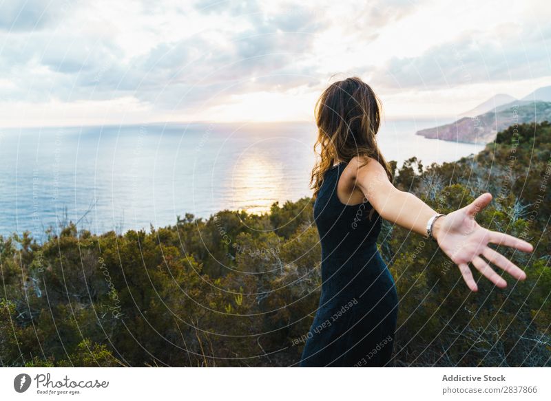 Woman posing on nature Landscape Posture Ocean Tourist Adventure Nature Panorama (Format) Freedom Relaxation Traveling romantic achievement Tropical Summer