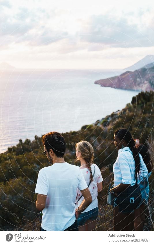 Group of people standing on cliff Human being Tourism Landscape Freedom Action Ocean Adventure Summer Exterior shot Vacation & Travel Tourist multiethnic Black