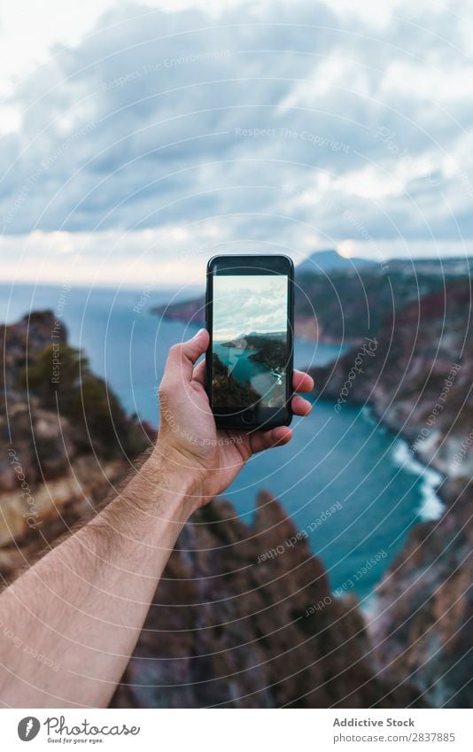 Crop man taking photo of landscape Man Ocean PDA Landscape Point in time seascape Photography Screen Technology Vacation & Travel Illustration Summer Nature