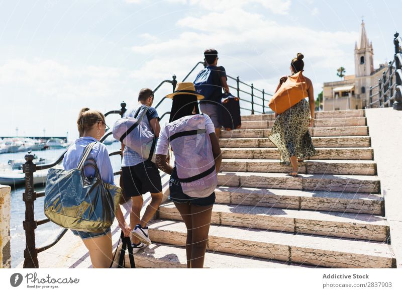 Friends walking in city and traveling Human being Friendship Traveling City Group Tourist Town Street Sightseeing Exterior shot Vacation & Travel Team Summer