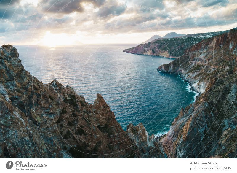 Aerial view to mountain lake Coast Rock Waves Tropical Ocean Powerful Exotic Energy Deserted Cliff Summer Beach Nature Idyll seaside Vantage point Natural