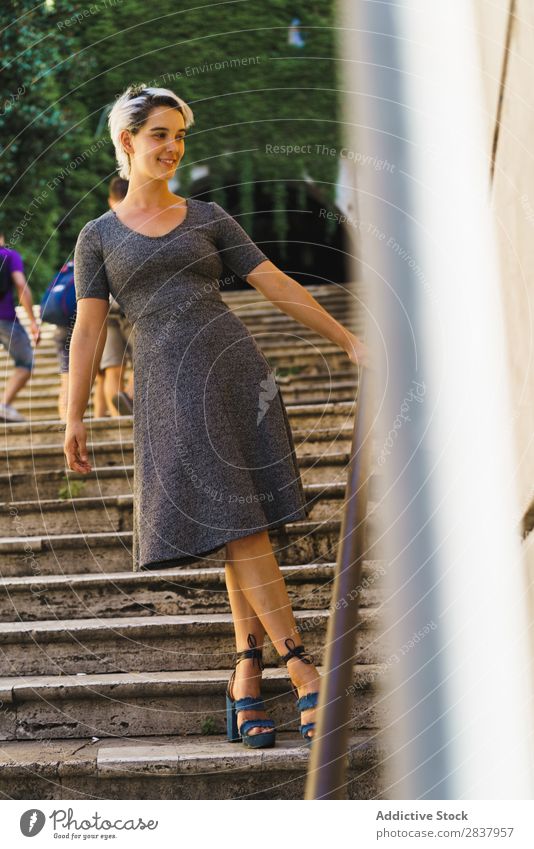 Pretty woman posing on stairs Woman Steps pretty Street Posture Youth (Young adults) Easygoing Handrail Girl Fashion City Beauty Photography step Stairs Model