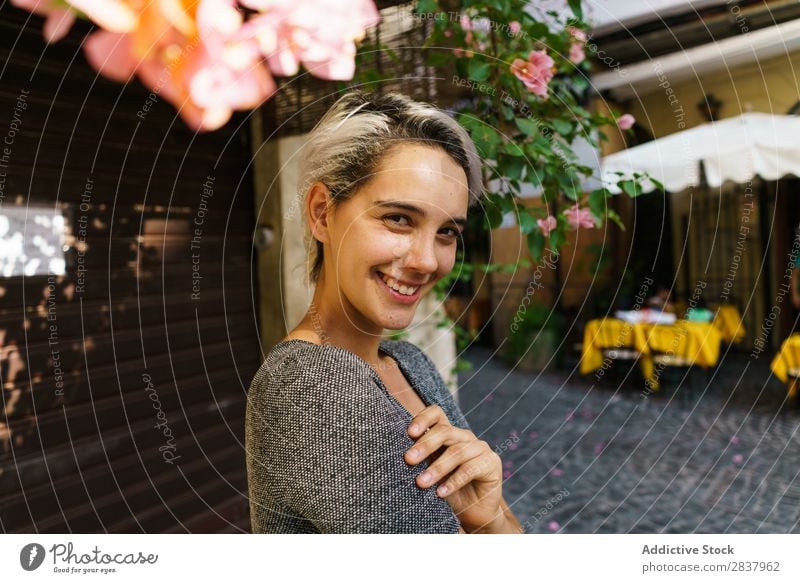 Smiling woman at blooming tree Woman Street Flower Tree Blooming Posture Cheerful arms crossed Summer Spring City Attractive Girl Beautiful Hair Happy