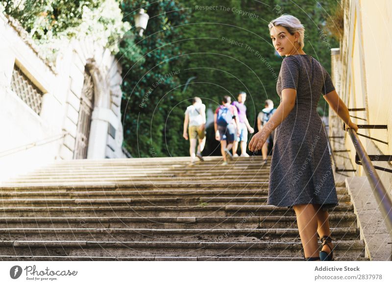 Pretty woman posing on stairs Woman Steps pretty Street Posture Youth (Young adults) Easygoing Handrail Girl Fashion City Beauty Photography step Stairs Model