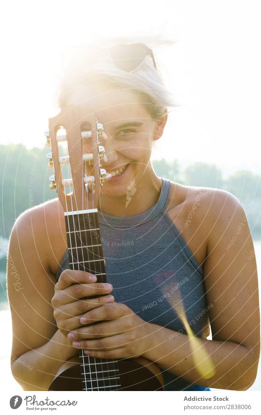 Girl posing with small guitar at street Woman Street Entertainment Ukulele Musician City Lifestyle Style Summer Leisure and hobbies Beauty Photography