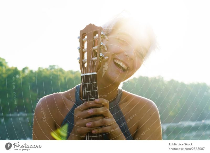 Girl posing with small guitar at street Woman Street Entertainment Ukulele Musician City Lifestyle Style Summer Leisure and hobbies Beauty Photography