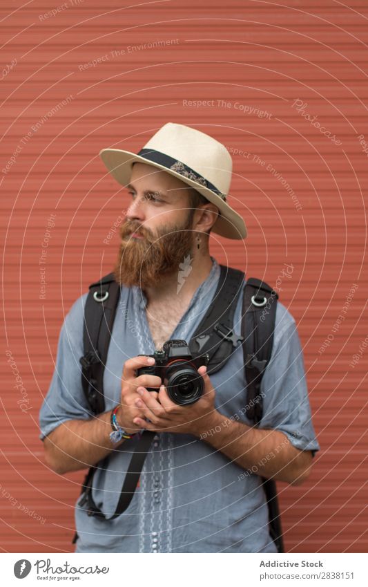 Photographer posing on wall Man bearded Style Posture Considerate Youth (Young adults) Hair and hairstyles handsome Masculine Appearance Earnest Vertical