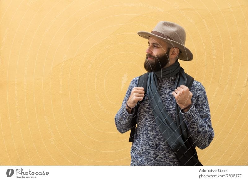 Tourist at yellow wall Man Backpack Wall (building) Yellow Looking away Youth (Young adults) Vacation & Travel Tourism Human being Guy Trip bearded Hat handsome