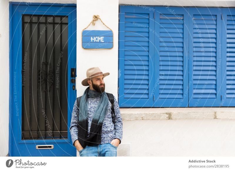 Man standing at home sign Style Street Home Plate Sign Posture Looking away Human being bearded handsome Hat Youth (Young adults) Portrait photograph Town