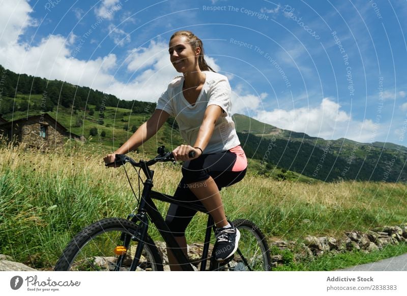 Woman riding bike Athletic Bicycle Cheerful Smiling Sports Cycle Girl Action Lifestyle Cycling Human being workout Mountain Motorcycling Relaxation Asphalt