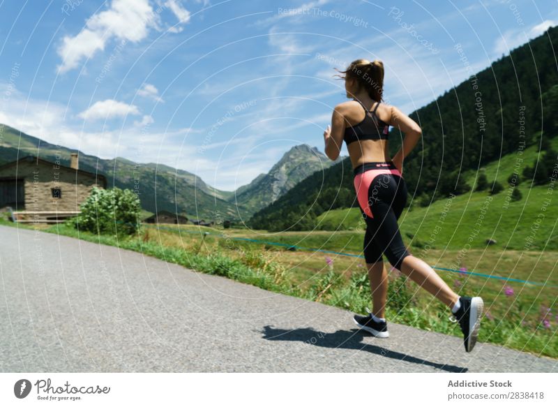 Woman jogging in countryside Street Jogging Rural Athletic Youth (Young adults) Fitness Practice Athlete Sports Landscape workout Leisure and hobbies Action