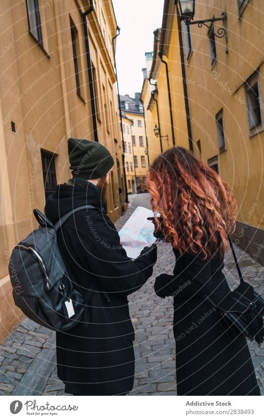 Couple with map on street Street Happy City Human being Map Navigation Vacation & Travel Tourism Love Happiness Relationship Cheerful Youth (Young adults) Man