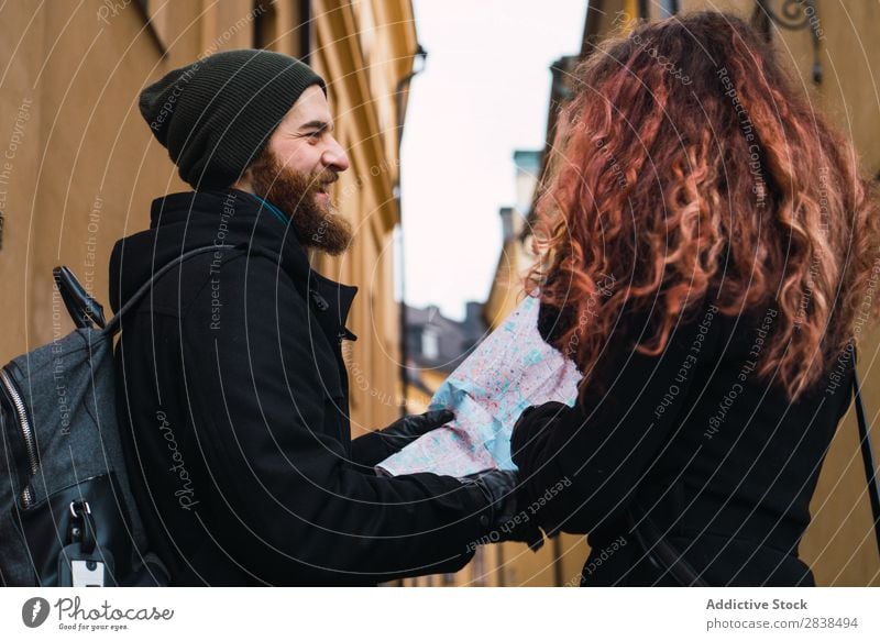 Couple with map on street Street Happy City Human being Map Navigation Vacation & Travel Tourism Love Happiness Relationship Cheerful Youth (Young adults) Man