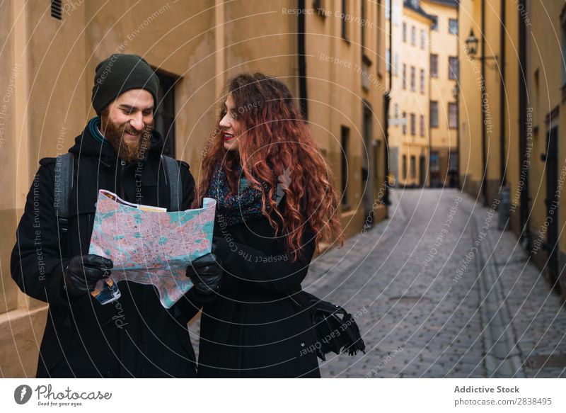 Couple with map on street Street Happy City Human being Map Navigation Vacation & Travel Tourism Love Happiness Relationship Cheerful Youth (Young adults) Man