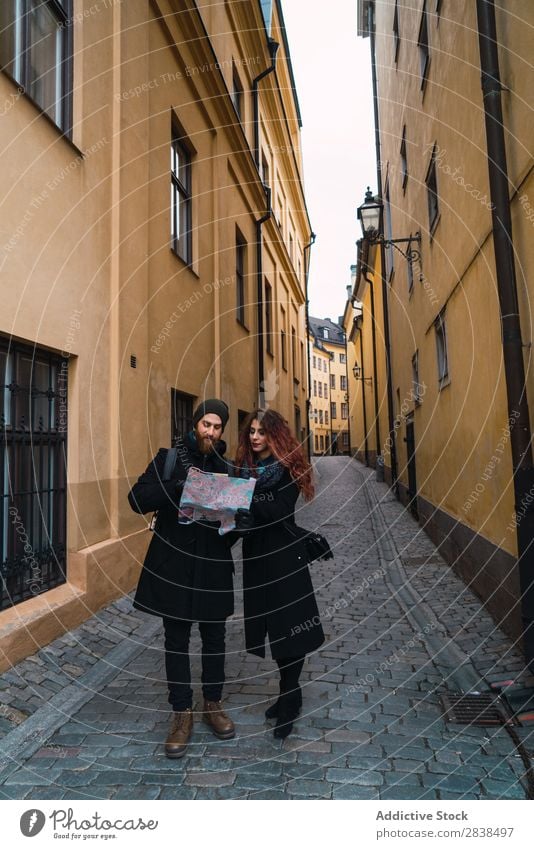 Couple with map on street Street Happy City Human being Map Navigation Vacation & Travel Tourism Love Happiness Relationship Cheerful Youth (Young adults) Man