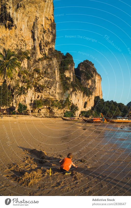 Little boy playing with sand Boy (child) Playing Sand Beach Summer Child Ocean Vacation & Travel Happy Youth (Young adults) Lifestyle Infancy Joy Water