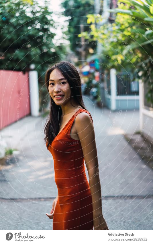 Cheerful woman posing on street Woman pretty asian Youth (Young adults) Happy Joy Street Green Town Beautiful Portrait photograph Attractive Beauty Photography