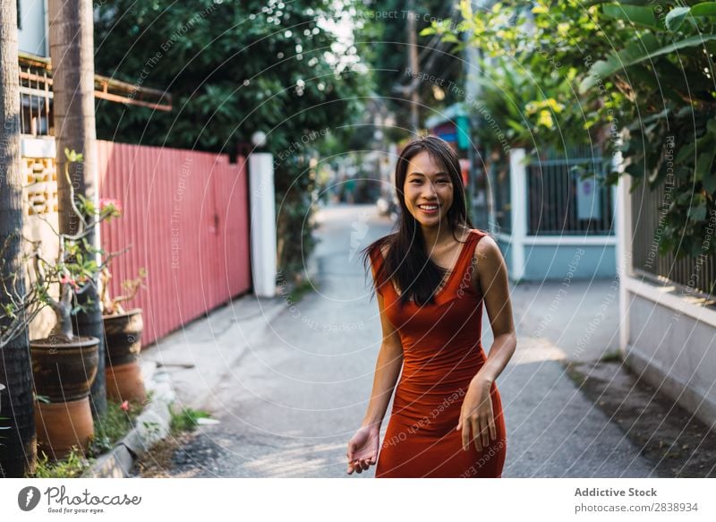 Cheerful woman posing on street Woman pretty asian Youth (Young adults) Happy Joy Street Green Town Beautiful Portrait photograph Attractive Beauty Photography