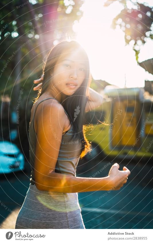 Cheerful Asian woman posing on street Woman pretty asian Youth (Young adults) Smiling Happy Joy Park Town Brunette Beautiful Portrait photograph Attractive