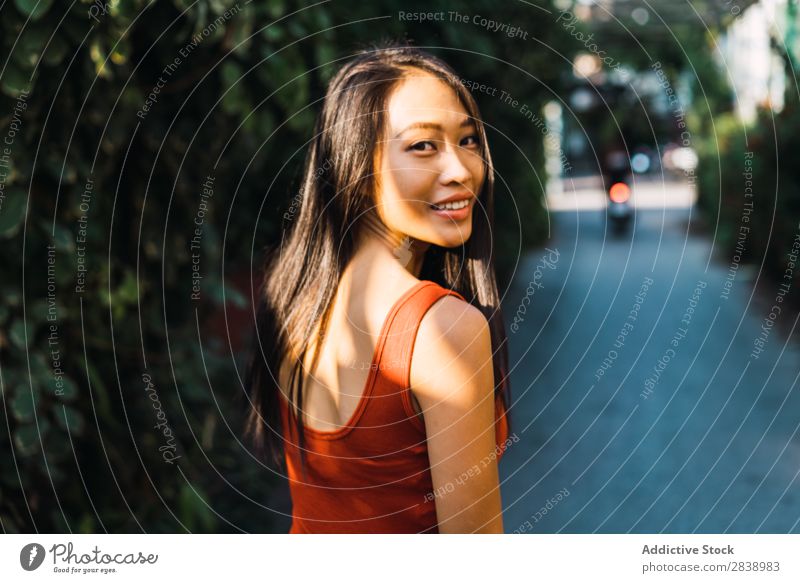 Cheerful woman posing on street Woman pretty asian Youth (Young adults) Happy Joy Street Green Town Beautiful Portrait photograph Attractive Beauty Photography