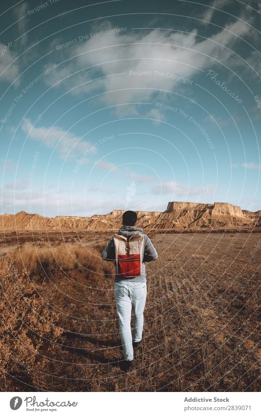 Man standing in dry grass Human being Tourist Nature Landscape Height Grass Landing Ground Environment Vacation & Travel Tourism Yellow Stone Wilderness