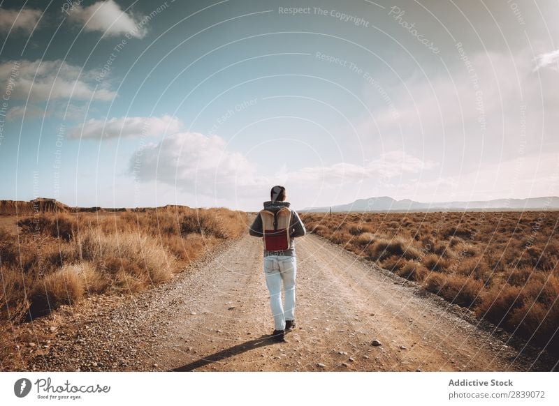 Cheerful man on dry road Human being Tourist Nature Dry Man Street Landscape Desert Landing Grass Sand Ground Environment Vacation & Travel Tourism Yellow Stone