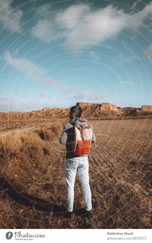 Man standing in dry grass Human being Tourist Nature Landscape Height Grass Landing Ground Environment Vacation & Travel Tourism Yellow Stone Wilderness