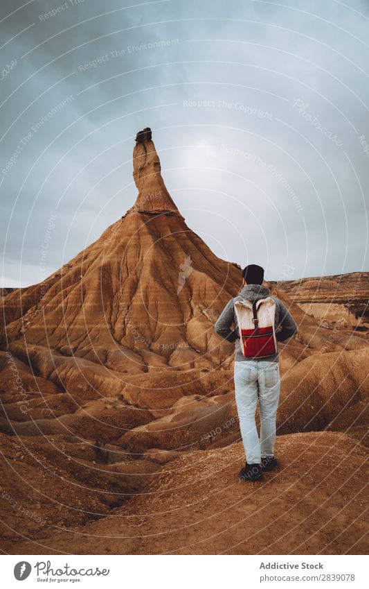 Man posing near big sandy hill Hill Mountain Nature Dry Tall Height Landscape Vacation & Travel Desert Landing Grass Sand Ground Environment Yellow Stone