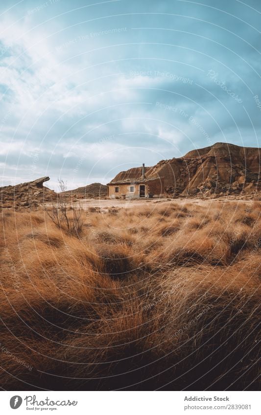 Small house and hill Hill Mountain Nature Dry House (Residential Structure) Building Landscape Vacation & Travel Desert Landing Grass Sand Ground Environment