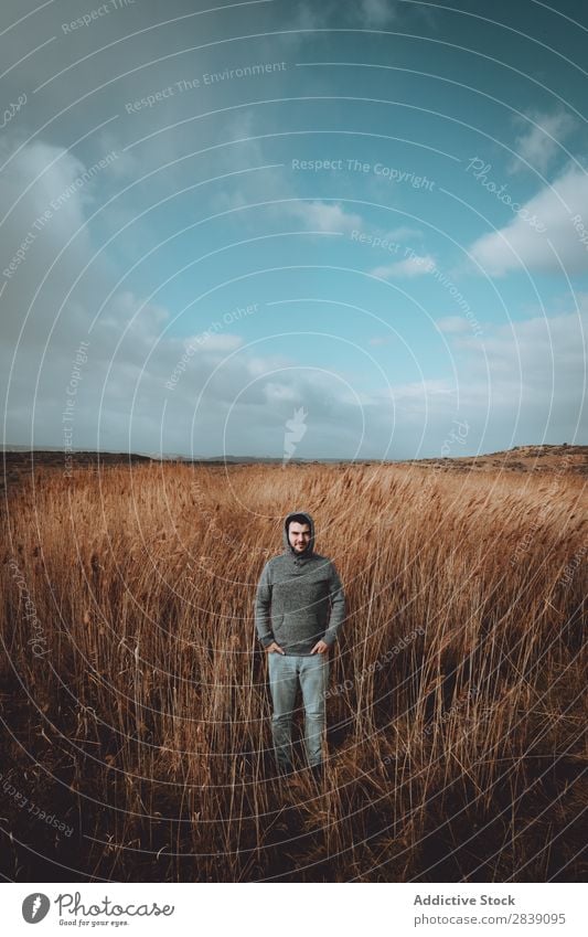 Man standing in dry grass Human being Tourist Nature Landscape Height Grass Landing Ground Environment Vacation & Travel Tourism Yellow Stone Wilderness