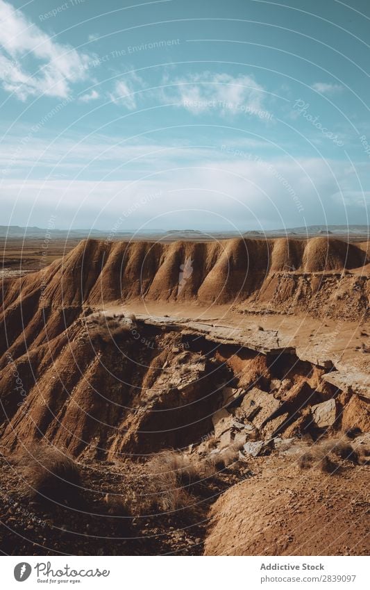 Sandy hill with cracking edge Hill Mountain Edge Nature Dry Landscape Vacation & Travel Desert Landing Grass Ground Environment Yellow Stone Wilderness