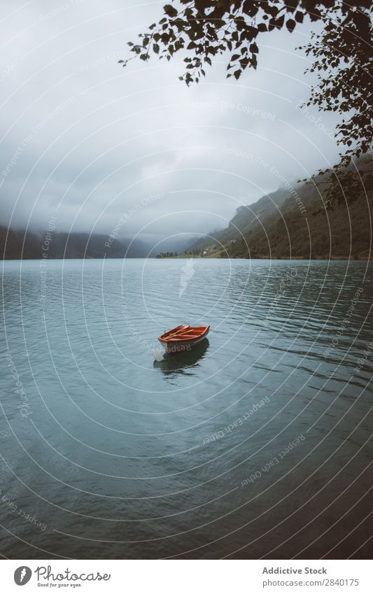 Small rowboat in norwegian fjord Reflection Leisure and hobbies Vantage point Sit Nature Vacation & Travel Pond Stand Relaxation Fishery 1 River Green Sports