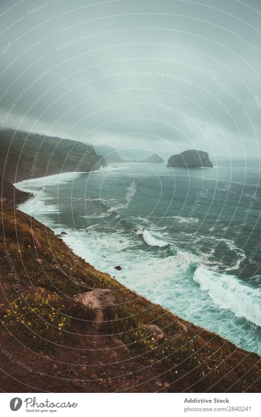 Stormy sea and shoreline Landscape Coast Rough Tide Dramatic seaside Nature Rock Natural Destination Waves Environment Splashing Wanderlust Passion Dangerous