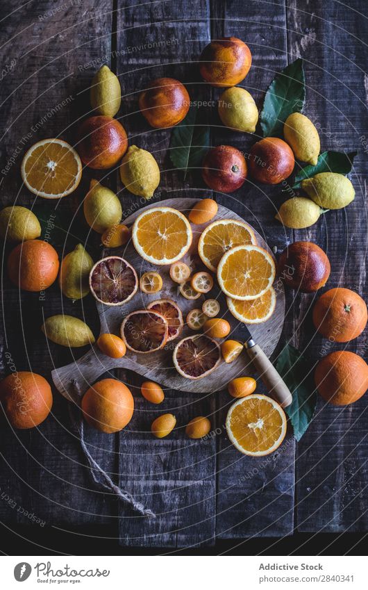 Sliced citruses on wooden table Lemon Orange Red Fresh Tasty Fruit Food Exceptional assortment diversity Healthy Yellow Sweet Organic Mature Juicy Vitamin