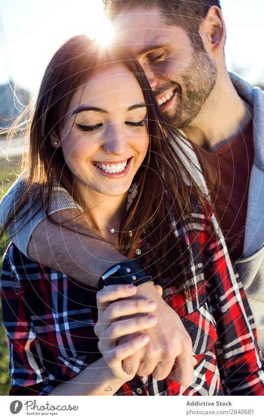 Happy young couple having fun in a park. Laughter Smiling Vacation & Travel Calm Relaxation Park Boy (child) Summer Easygoing Cute Youth (Young adults)