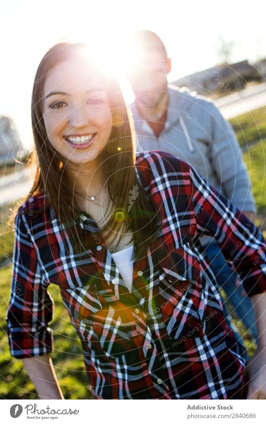 Happy young couple having fun in a park. Laughter Smiling Vacation & Travel Calm Relaxation Park Boy (child) Summer Easygoing Cute Youth (Young adults)