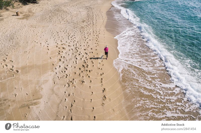 Photography aerial of woman doing running. Above Action Aircraft Athlete Beach Practice Woman Athletic Fitness Girl Healthy Jogger Jogging Lifestyle