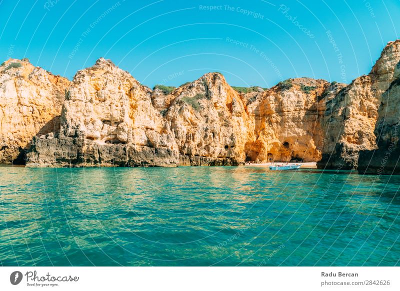 Ocean Landscape With Rocks And Cliffs At Lagos Bay Coast In Algarve, Portugal Nature Hole Cave Beach Stone Arch Window Vantage point Beautiful Vacation & Travel