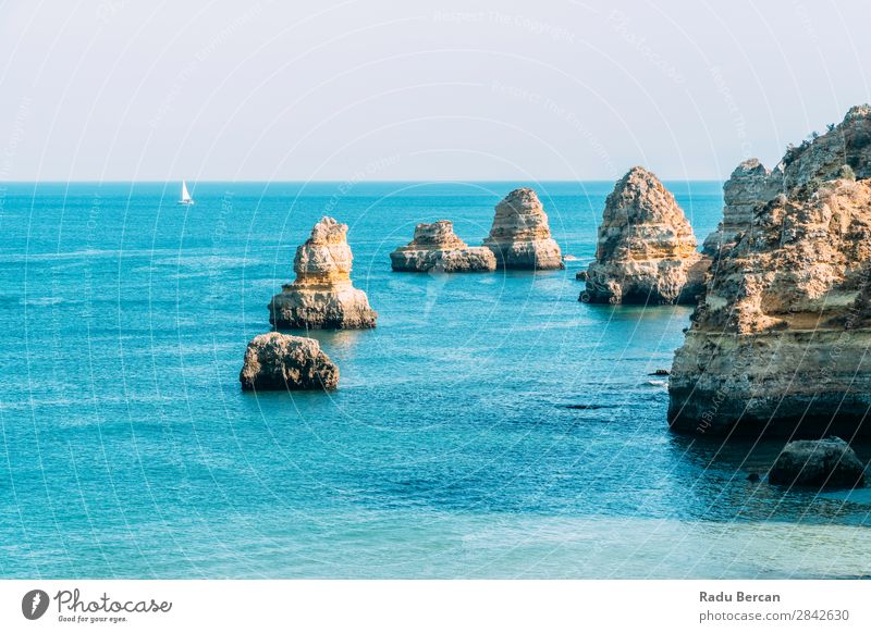 Ocean Landscape With Rocks And Cliffs At Lagos Bay Coast In Algarve, Portugal Nature Hole Cave Beach Stone Arch Window Vantage point Beautiful Vacation & Travel