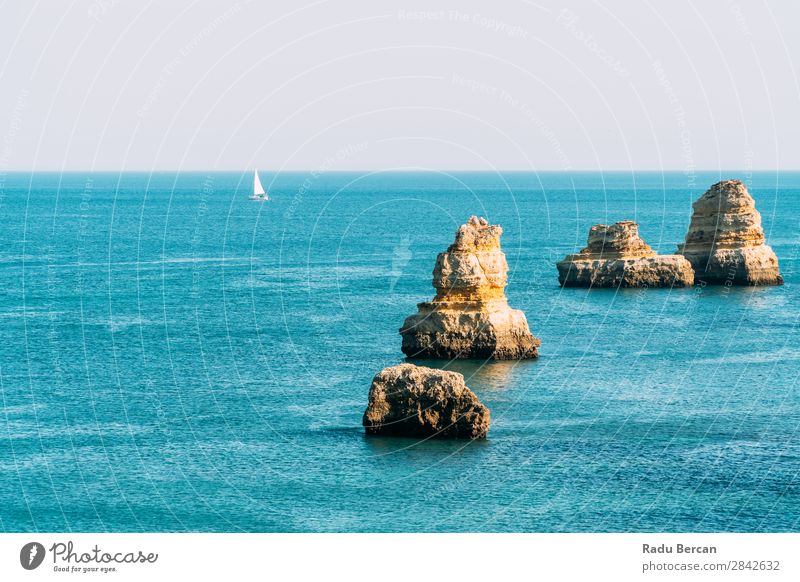 Ocean Landscape With Rocks And Cliffs At Lagos Bay Coast In Algarve, Portugal Nature Hole Cave Beach Stone Arch Window Vantage point Beautiful Vacation & Travel