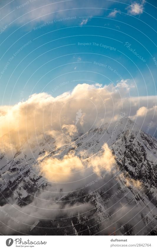 cotton wool clouds Nature Landscape Elements Sky Clouds Sunrise Sunset Winter Beautiful weather Wind Ice Frost Rock Alps Mountain Peak Snowcapped peak Esthetic