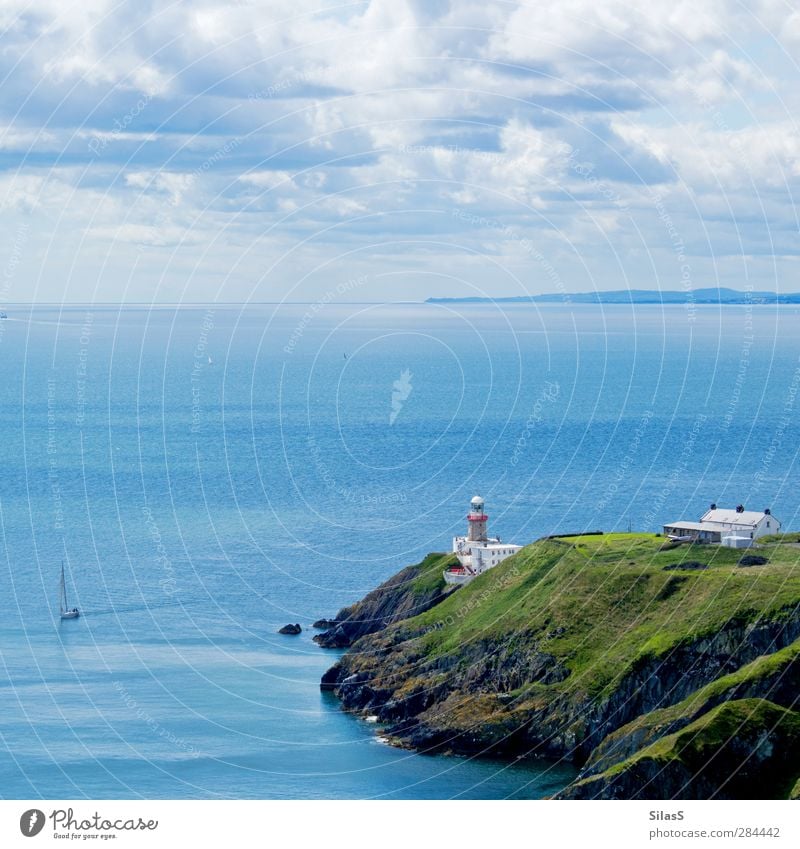 Holiday on the island Nature Sky Clouds Summer Rock Waves Coast Ocean Island Cliff England House (Residential Structure) Lighthouse Sailboat Blue Gray Green Red