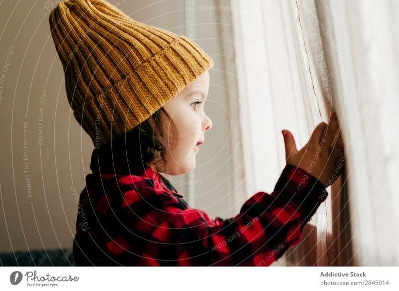 Cute boy posing in wool cap Boy (child) Excitement Hat Happy Child Youth (Young adults) Infancy Human being Easygoing Portrait photograph Expression Joy Small