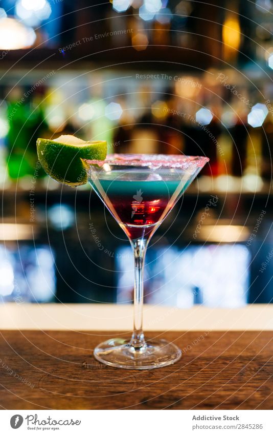 Cocktail on counter Bar Counter Alcoholic drinks Drinking Glass Party Restaurant Ice Night life Beverage Club Refreshment Fruit Lime layer Liquid Pub Nightclub